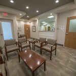Office waiting room with a table surrounded by chairs