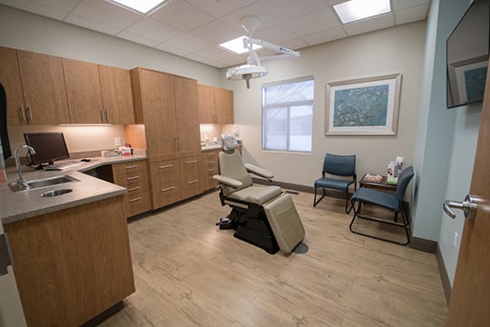 Patient room with window and chairs